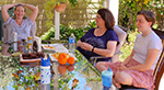 Jen and Jenny and Lucie talk and eat oranges on the patio